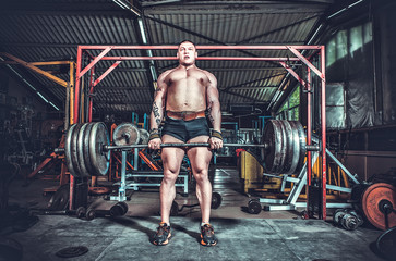 Powerlifter with strong arms lifting weights