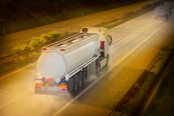 Motion blurred tanker truck on the highway.