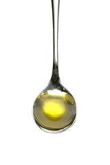Teaspoon of olive oil isolated on white