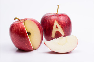 Apple isolated on white and alphabet.