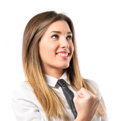 Young businesswoman winning over white background