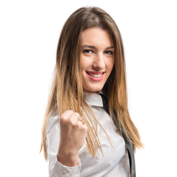 Young businesswoman winning over white background