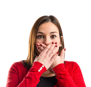 Woman with her mouth closed by her hands