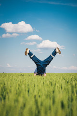 Happy farmer in the wheat
