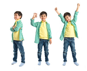 Boys making a victory sign on wooden chair over white background