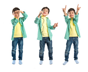 Kid singing, doing time-out gesture and making horn sign