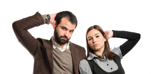 Cute couple thinking over isolated white background