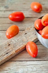 fresh tomatoes in metal bowl