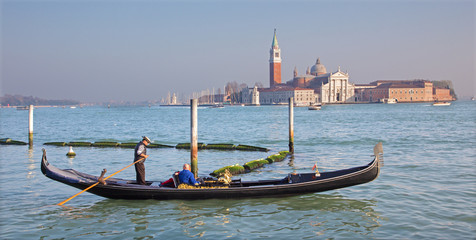 Venice - Gondolier on the lagoon and San Giorgio Maggiore - obrazy, fototapety, plakaty
