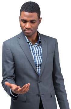Focused businessman holding hand out