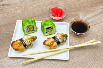 Japanese Cuisine - Sushi c smoked eel and rolls with caviar.