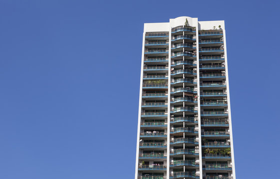 Hi rised condominium on clear blue sky