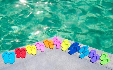 Color flip flops by the pool