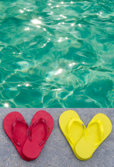 Fototapeta premium Color flip flops by the pool