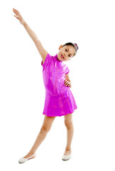 young cute ballet dancer girl in pink dress dancing on white