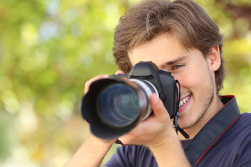 Photographer photographing with a dslr digital camera