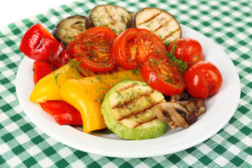 Delicious grilled vegetables on plate on table close-up