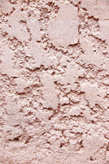 Uneven surface of cement wall.