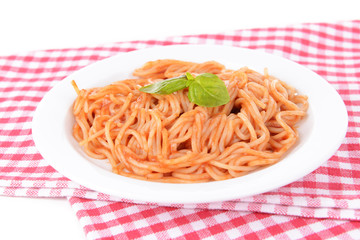 Pasta with tomato sauce on plate on table close-up