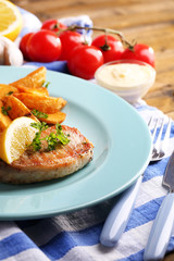 Grilled steak, grilled vegetables and fried potato pieces