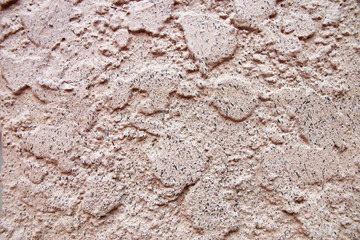 Uneven surface of cement wall.