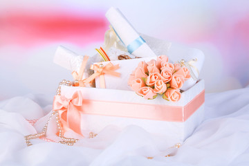 Beautiful handmade wedding cards in box, on light background