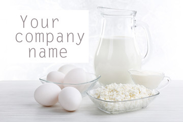 Tasty dairy products on wooden table