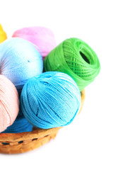 Fototapeta na wymiar Colorful yarn balls for knitting in wicker basket, isolated