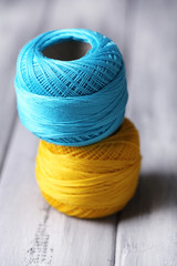 Colorful clews on wooden background