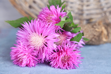 Cornflowers on wooden background