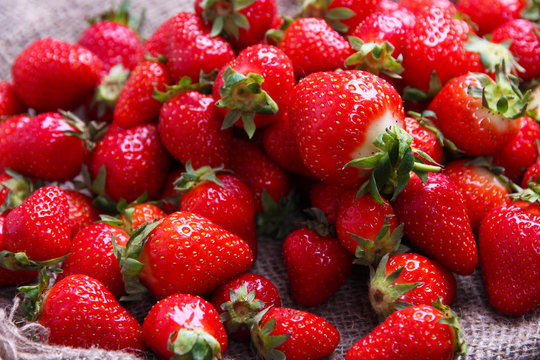 Ripe sweet strawberries on sackcloth  background