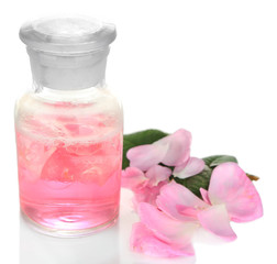 Obraz na płótnie Canvas Rose oil in bottle isolated on white