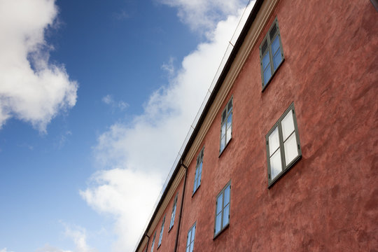 Bottom view of the red facade scandinavian house