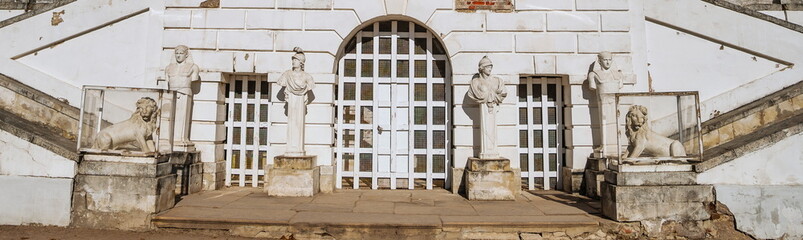 Fragment of  old staircase, decorated with antique sculptures