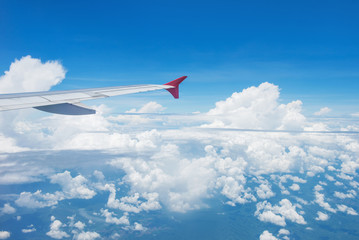 Fototapeta premium Wing of an airplane flying in the sky