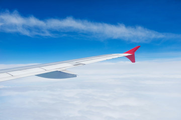Fototapeta premium Wing of an airplane flying in the sky