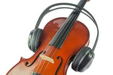 Black headphones on a classical wooden violin