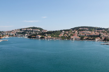 Fototapeta na wymiar Croatian Homes Across Calm Blue Bay