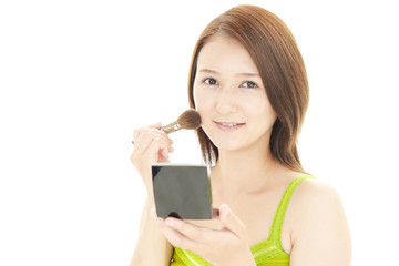 Fototapeta premium 化粧をする女性