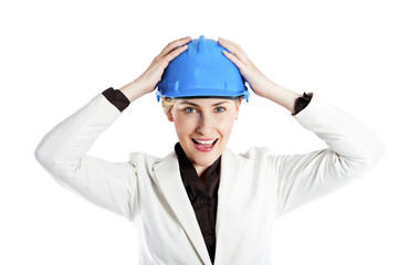 Portrait of confident young female architect standing arms over