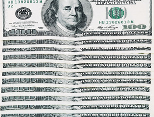100 dollar bills arranged horizontally