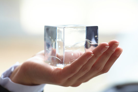 glass cube in the hand