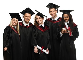 Multi ethnic group of graduated young students isolated on white