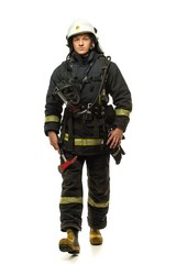 Obraz premium Young firefighter with helmet and axe isolated on white