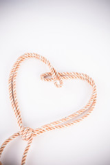 orange rope in heart shape with vignette