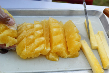 A lot of ripe pineapple for sale.