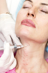 Cosmetic treatment with injection in a clinic