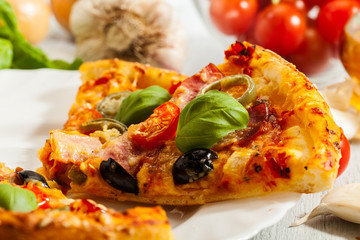 Pizza with bacon, olives and jalapeno pepper