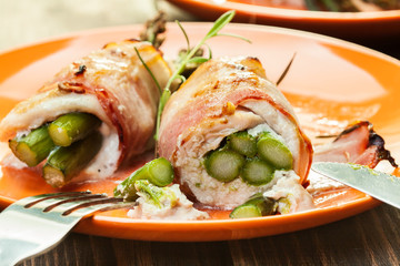 Baked asparagus wrapped in chicken and bacon