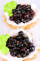 sweet cakes with berries isolated on white